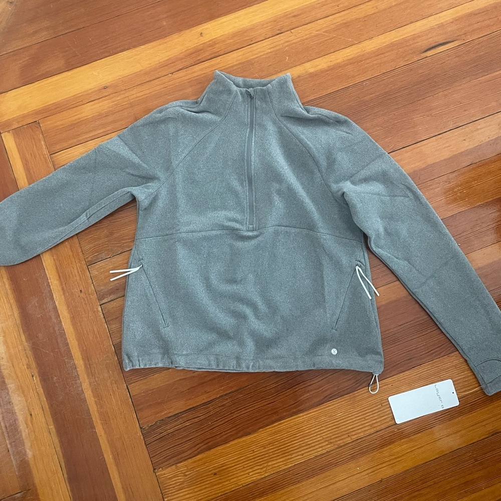 Medium. Long Sleeve Fleece Layer. New with tags. Never worn.